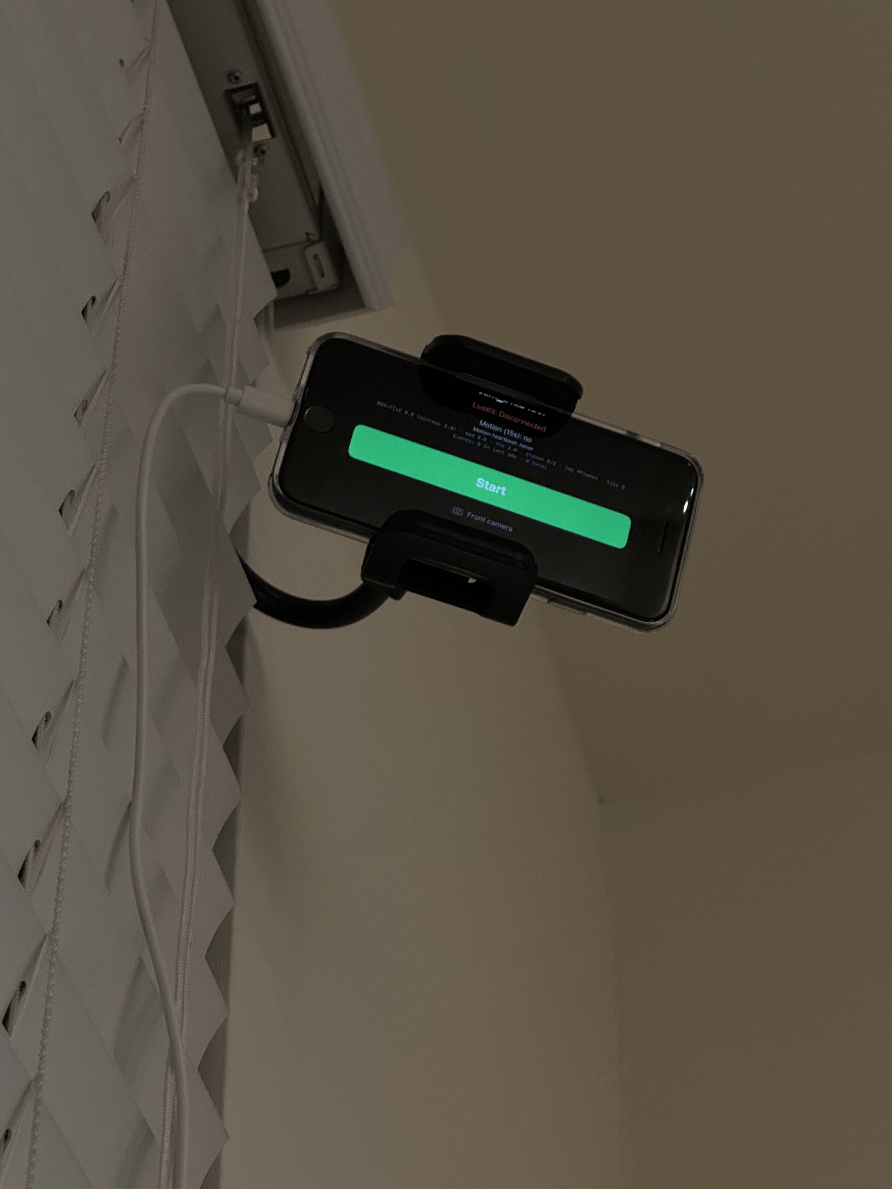 Room phone mounted with the screen facing the room
